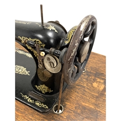Early 20th century Singer treadle sewing machine with cast iron base 