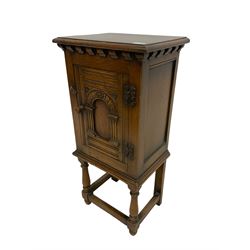 Jacobean style oak cupboard on stand, fitted with single drawer