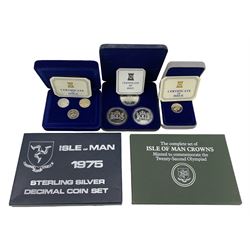 Three Pobjoy Mint Isle of Man proof coins or sets, comprising sterling silver and verinium three one pound coins, verinium one pound coin and '25th Anniversary of the Coronation of Her Majesty Queen Elizabeth II 1953-1978' three crown coins, Isle of Man 175 sterling silver decimal coin set and The Complete set of Isle of Man Crowns, Minted to Commemorate the Twenty-second Olympiad (5)