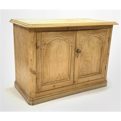 Victorian pine side cabinet, moulded top over double fielded panelled doors enclosing shelves, skirted base 