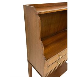 Edwardian Revival mahogany bookcase, shaped ends supporting upper shelf over two short and one long drawers, on moulded tapering and out-splayed supports joined by undertier