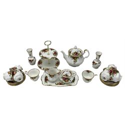 Royal Albert Old Country Roses tea set comprising eight cups and saucers, two tier cake stand, tea pot, sugar bowl and cover, milk jug, serving plate and a pair of matching vases H15cm (23)