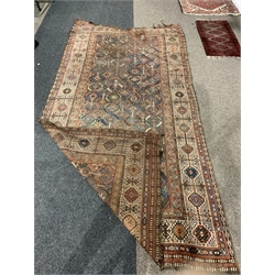 Central Asian design ground carpet, with repeating geometric decoration on blue field, enclosed by multi line border, 365cm x 180cm