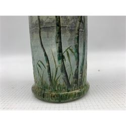 Daum Summer Landscape cylindrical glass vase circa 1900,  the mottled, overlaid and acid-etched body finely enamelled with a continuous lake scene with birch trees and grasses in the foreground, signed Daum Nancy and with the Cross of Lorraine to the underside, H16.5cm x D5cm 