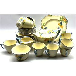 1930's Crown Ducal 'Rosemary' pattern tea set comprising eleven teacups, twelve saucers, twelve saucers, teapot, sugar bowl, milk jug and two serving plates 