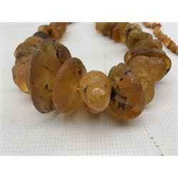 Large natural amber beaded necklace and another, gross weight 491g approx