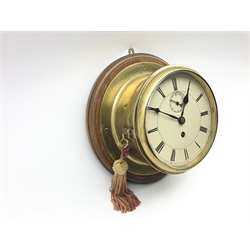 Early 20th century brass cased ship's bulk head clock, circular Roman dial with subsidiary seconds dial, single fusee movement marked Bristol, on stained wooden mount, total diameter - 31cm