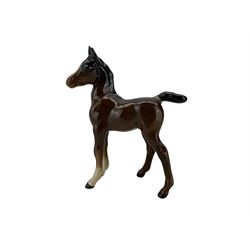 Beswick to include two foxes, no. 1016A and 1017, Huntsman, model No. 1501, brown gloss, a further brown gloss horse & foal (5)