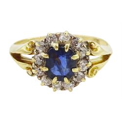 Gold oval sapphire and diamond cluster ring, stamped 18c