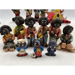Robertson's Golly figures comprising a set of twelve plastic Footballers marked 'Foreign' beneath, eleven porcelain jazz figures, sixteen plaster figures and others 