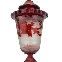 19th century Bohemian ruby overlay glass goblet vase and cover, the funnel shaped bowl wheel engraved with a leaping Stag and Deer in a woodland landscape, hexagonal ruby glass cover with knopped finial, the bowl supported by a faceted baluster stem and shaped circular foot, the cover and foot each engraved with fruiting vines, H44cm overall, vase H28cm, bowl D11cm 