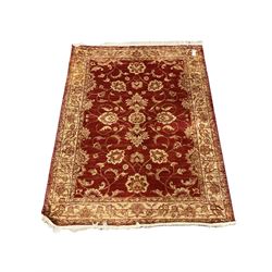 Red and ivory ground rug 