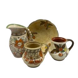 Crown Ducal Charlotte Rhead jug decorated in the Ankora pattern no. 5983 with graduated handle H22cm, Circular Fruits pattern no. 5982 jug and fruit bowl together with a small jug in the Golden Leaves no.4921 (4)