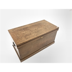 Late 19th / Early 20th century oak silver chest, the hinged lid lifting to reveal baize lined lift out tray, metal carry handle to each end, on a skirted base