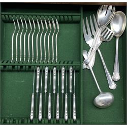 Quantity of German silver cutlery, the stems of tapering serpentine outline and initialled 'R' comprising twelve large dessert spoons, twelve table forks, twelve fish forks, eight small dessert spoons, nine teaspoons, six coffee spoons, thirty five silver handled knives in various sizes, various serving implements, ladles etc 124 pieces with crescent and crown mark, some marked 800 and makers mark Dreyfuss approx 135oz excluding knives   in an oak five drawer cabinet