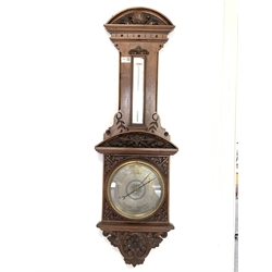  Victorian carved oak aneroid barometer and thermometer, with silvered registers, H101cm  