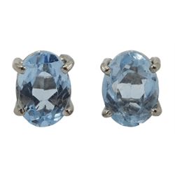 Pair of 18ct white gold single stone oval aquamarine stud earrings