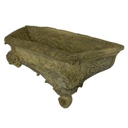 Composite stone wall pocket or planter, decorated with rams head and foliate decoration
