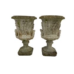 Pair reconstituted stone garden Medici style urn planters, flared foliate moulded rim over body decorated with classical figures dancing and playing pan pipes, raised on fluted socle with gadroon decoration and square canted base; (2)