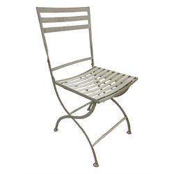 Set of four white finish wrought metal strapwork folding garden chairs