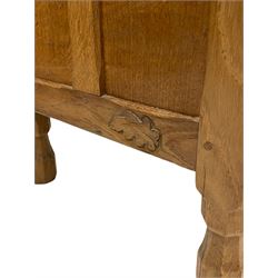 'Oakleafman' adzed oak bedside or lamp table, rectangular top over shelf and triple panelled fall front, panelled sides carved with leaf signature, by David Langstaff of Easingwold