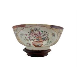 18th century Chinese Export punch bowl decorated with reserves of flowers on a textured ground, with geometric and diaper borders, on hardwood stand, D26.5cm 

