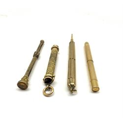 19th/ early 20th century propelling pencils to include an engraved example with amber glass matrix, two with engine turned design and another (4)