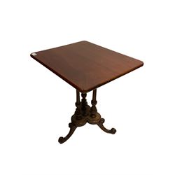 Regency design mahogany occasional table, the rectangular top raised on three turned and reeded columns, united by base terminating in splayed and scrolled supports