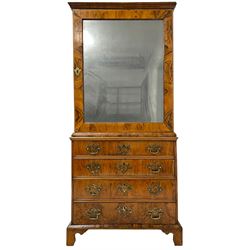 George II walnut cabinet on chest, top section with mirror panelled door and banded border concealing three adjustable shelves, the lower section fitted with four graduating drawers, each with bookmatched veneer fronts, raised on shaped bracket feet, stamped 'RE' to inside of drawers