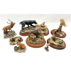 Collection of Border Fine Arts figures comprising Action Dogs - 'Black Labrador and Pheasant', 'The Poacher', two other Otter groups, Red Stag, Small robin on bronze branch and other figures (8)
