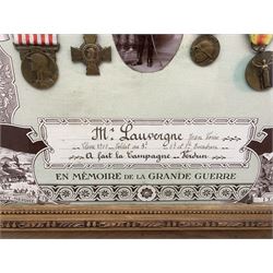 French framed World War I memorial to Jean Louis Lauvergne comprising War Medal, Victory Medal, Verdun Medal and Croix de Combattants together with a photograph 'En Memoire de la Grande Guerre' 45cm x 55cm