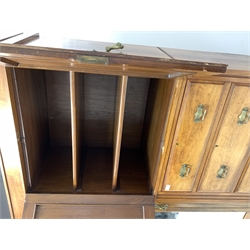 Late Victorian wardrobe, double urn carved cupboard enclosing two fixed shelves above three graduating drawers and flanked by a bevel edged mirrored door enclosing interior fitted for hanging, two drawers under, shaped plinth base 