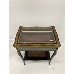 Late 19th / early 20th century French boulle and ebonised rosewood bijouterie table, the hinged top with bevelled glass plate and floral cast ormolu mounted lifting to reveal velvet lined interior, raised on shaped slender supports united by under tier, terminating in sabot feet 62cm x 42cm, H77cm