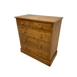 Rustic pine straight-front chest, fitted with two short and three long drawers with wooden handles, on plinth base 