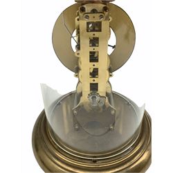 Late 20th century eight-day German skeleton clock with passing strike on bell, Hermle single train movement with anchor escapement and visible brass pendulum bob, white chapter ring with black Roman numerals and minute track, black steel hands, movement plates attached to a brass effect circular base, housed under a circular acrylic dome, with key.