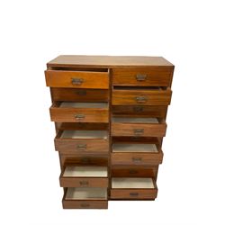 Late 19th century mahogany straight-front chest, fitted with two vertical banks of ten drawers, each fitted with Aesthetic Movement brass handles with foliate decoration, each drawer flanked by reeded decoration, raised on a plinth base