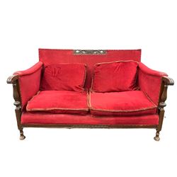 20th century oak framed sofa, upholstered in later red fabric, raised on turned supports 