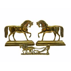 Pair of 19th century brass hearth ornaments in the form of standing horses on a stepped base H23cm and another of plough horses