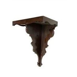 Victorian - late 19th century mahogany wall bracket with a wavy apron to the front and sides, shaped back with conforming central support, and steel hanging eyes.