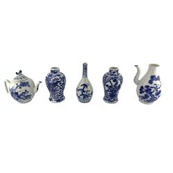 A matched pair of 19th century Chinese blue and white baluster form vases, one painted with a Dragons amidst flowers and foliage, the other with two opposing cartouche panels painted with exotic birds, 18th/ 19th century Chinese coffee pot painted with birds in a tree, Chinese teapot and Japanese vase (5)