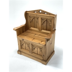 Stripped pine single seat box pew of gothic design, two panelled back and base, seat hinged to reveal storage compartment, W86cm