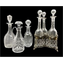 Edwardian silver-plated pierced three bottle decanter stand, together with three other decanters 