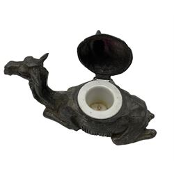 Early 20th century cast metal inkwell in the form of a seated camel, L12cm x H6cm together with a modern cut glass decanter with silver collar by A Edward Jones Ltd, 1993 H29cm