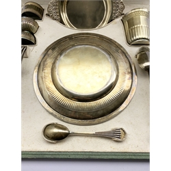 French silver and parcel gilt christening set comprising a circular plate with chased leaf decoration D20cm, dessert spoon and fork, egg spoon, double ended egg cup, napkin ring, beaker H8cm and a shallow circular bowl with flattened handles 18cm 23oz.  Tooled green  fitted plush lined case inscribed ' Boin-Taburet Orfevre, Rue Pasquier .3, Paris.   The original recipient of this set was born in 1899 and then by descent