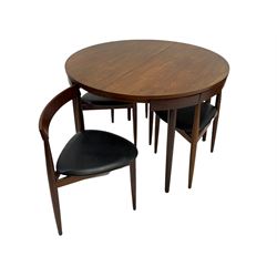 Hans Olsen for Frem Rølje - circa. 1960s 'Roundette' teak dining table, circular extending top with foldout leaf, with set four nesting dining chairs, triangular seats on three tapering supports, stamped 
