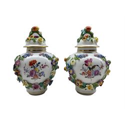 Pair of early 20th century Dresden porcelain floral encrusted vases and covers, each hand painted with a courting scene and flowers to the reverse, H20cm 