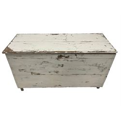 Late 19th century painted pine chest or coffer, rectangular hinged top over deep compartment, raised on stile supports, in white finish