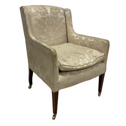 Edwardian mahogany framed armchair, back and sprung seat upholstered in foliate patterned ivory damask fabric, on square tapering supports with brass castors, with floral covering and matching loose cushion
Provenance: From the Estate of the late Dowager Lady St Oswald