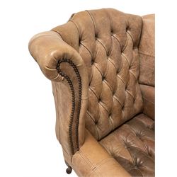 Georgian design hardwood framed wingback armchair, upholstered in buttoned and stitched tan leather with stud work detail, on cabriole feet