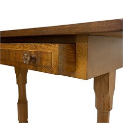 Beaverman - oak side table, rectangular adzed top, fitted with single drawer with Yorkshire rose carved handles, raised on octagonal turned supports with sledge feet, united by adzed stretcher, carved with beaver signature to foot, by Colin Almack, Sutton-under-Whitestonecliffe